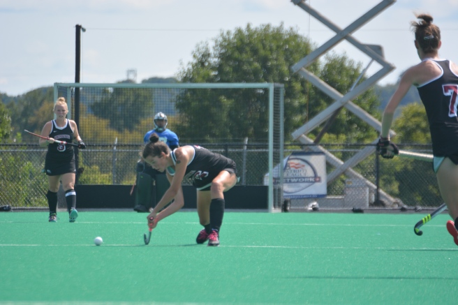 Audrey Sawers powers the ball downfield against Drexel